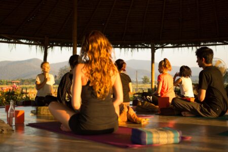 Yoga retreat group class at sunrise in Chiang Mai Thailand