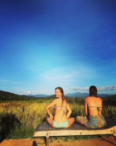 Cooling off after herbal steam sauna in rice field at Mala Dhara Yoga Retreat Center in Chiang Mai Thailand.